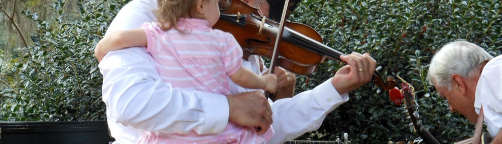 Dad and baby and fiddle